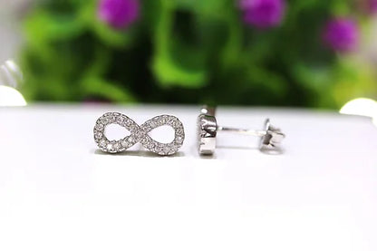 Aretes Infinito Plata 925 Baño Rodio y Zirconias