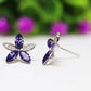 Aretes Flor Morada Plata .925 con Baño de Rodio y Zirconias
