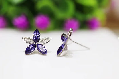 Aretes Flor Morada Plata .925 con Baño de Rodio y Zirconias