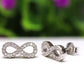 Aretes Infinito Plata 925 Baño Rodio y Zirconias